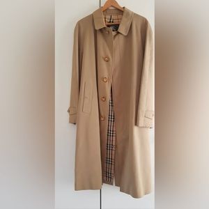 Vintage coat. Burberrys brand blue label, on beige.